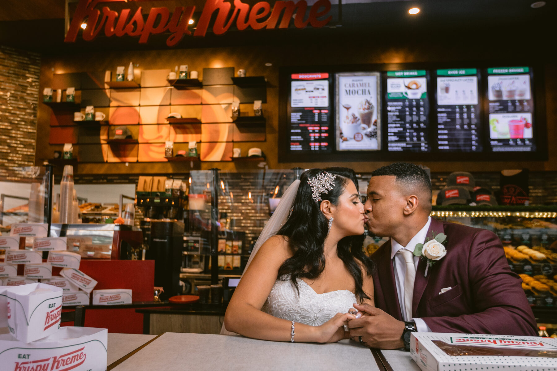 Newlyweds enjoying a playful late-night stop after the reception