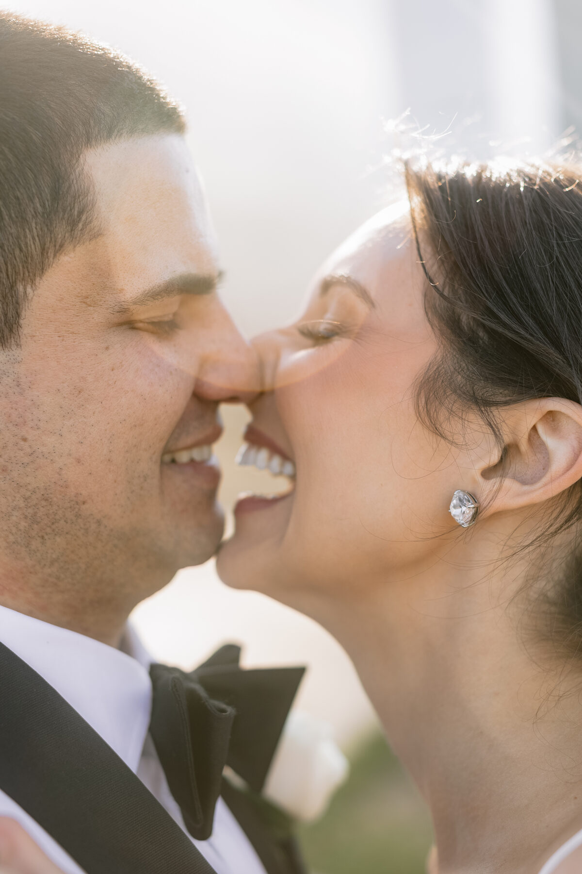 Intimate close-up wedding portrait of a couple in golden light